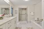 This stunning bathroom boasts a spacious layout with modern fixtures and finishes.