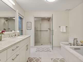 This stunning bathroom boasts a spacious layout with modern fixtures and finishes.
