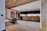 This stunning property boasts a rustic-chic kitchen with reclaimed wood cabinetry and modern appliances.
