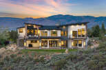Stunning modern home nestled in the mountains with breathtaking sunset views.