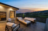 Luxury patio with fire pit and stunning sunset views.