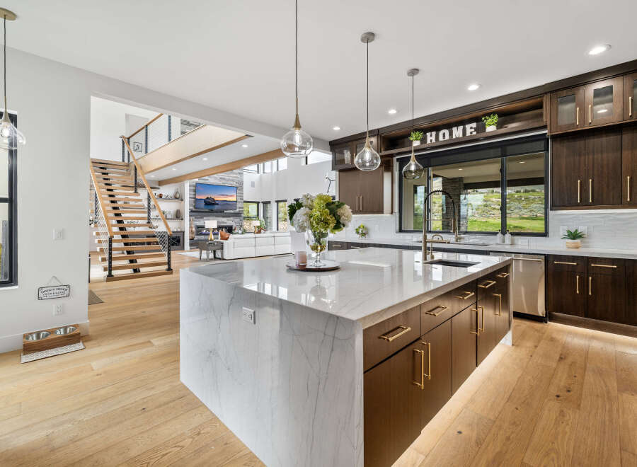 Stunning kitchen with marble island and custom cabinetry.