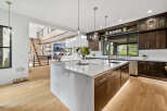 Stunning kitchen with marble island and custom cabinetry.
