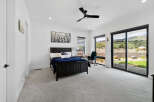 This bedroom boasts a modern design with large windows offering stunning views.