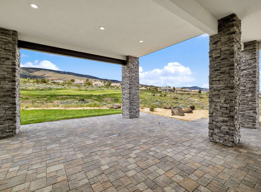 This stunning property boasts a spacious covered patio, perfect for outdoor entertaining.