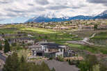 Luxury homes nestled on a golf course with breathtaking mountain views.