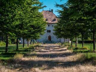 This stunning property boasts a charming chateau, surrounded by meticulously landscaped grounds.