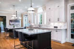 This stunning kitchen boasts a large island with seating, perfect for entertaining.