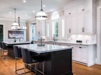 This stunning kitchen boasts a large island with seating, perfect for entertaining.