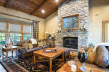 This stunning living room boasts a cozy stone fireplace, perfect for relaxing evenings.