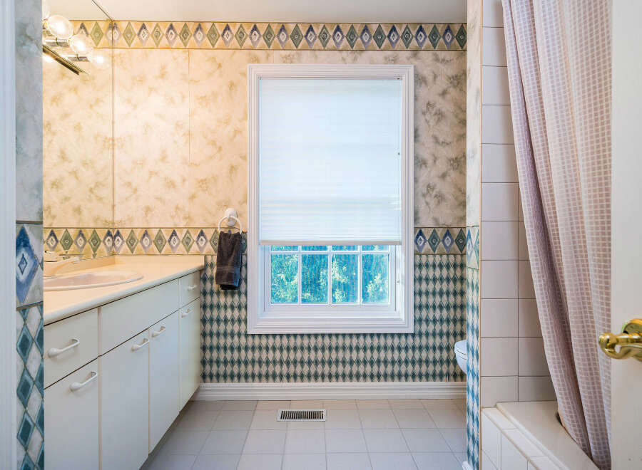 This charming bathroom boasts a classic design with updated features.