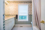This charming bathroom boasts a classic design with updated features.