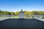 This stunning property boasts a private rooftop deck, perfect for enjoying breathtaking views of the surrounding landscape.