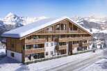Luxury chalet apartments in the French Alps, offering breathtaking mountain views and ski-in/ski-out access.