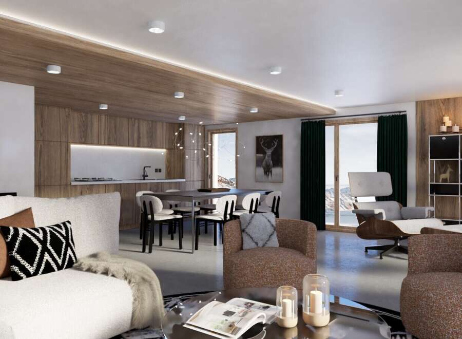 This stunning chalet boasts an open-plan living area with a modern kitchen, perfect for entertaining.