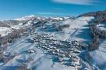 Nestled in a breathtaking snowy landscape, this charming village offers a serene escape.