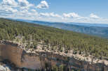 Spectacular cliffside property offering breathtaking panoramic views of rolling hills and mountain ranges.