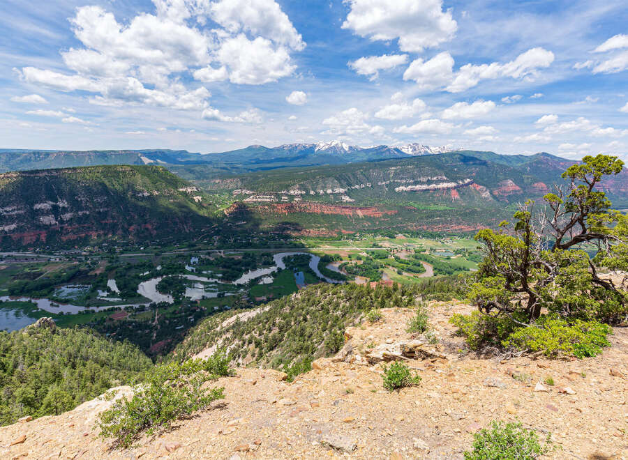 Spectacular mountain views and a serene river valley landscape are showcased in this breathtaking property.