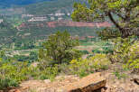 Enjoy breathtaking panoramic views of majestic mountains and valleys from this unique stone bench.