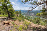 Spectacular panoramic views from this mountaintop property showcasing a lush valley and winding river.