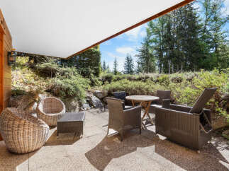 Relax and enjoy the stunning mountain views from your private patio.
