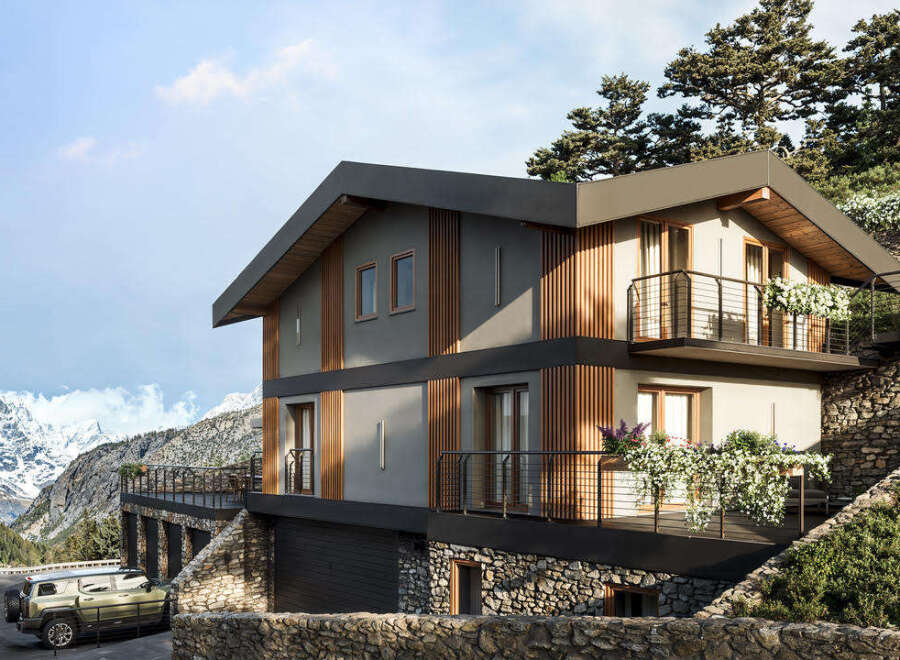 This modern mountain home boasts stunning architectural design with natural wood accents and a stone foundation.