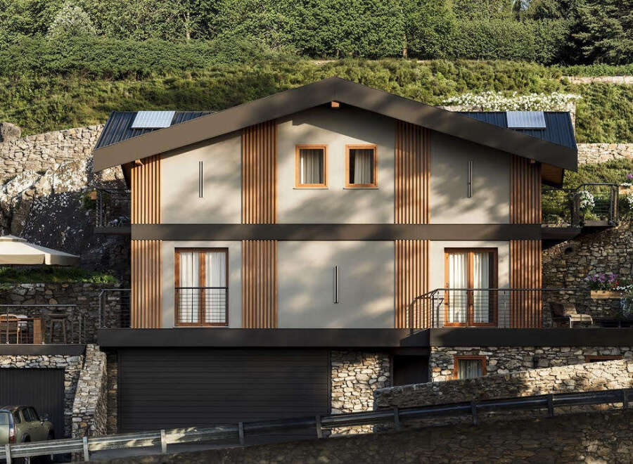 This modern mountain home features a unique facade with vertical wood slats and neutral siding, complemented by a dark roof and window frames.