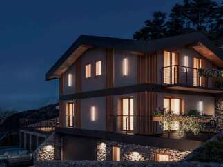 Discover this stunning modern house nestled in a picturesque mountain setting.