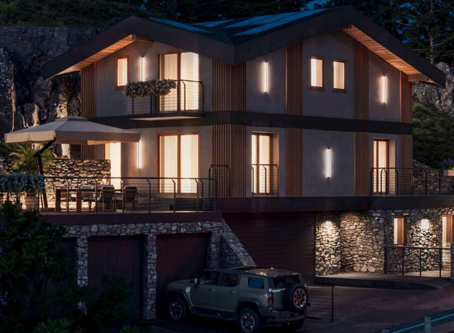 This stunning modern home boasts a multi-level design with stone accents and sleek wooden features.