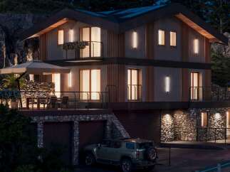 This stunning modern home boasts a multi-level design with stone accents and sleek wooden features.