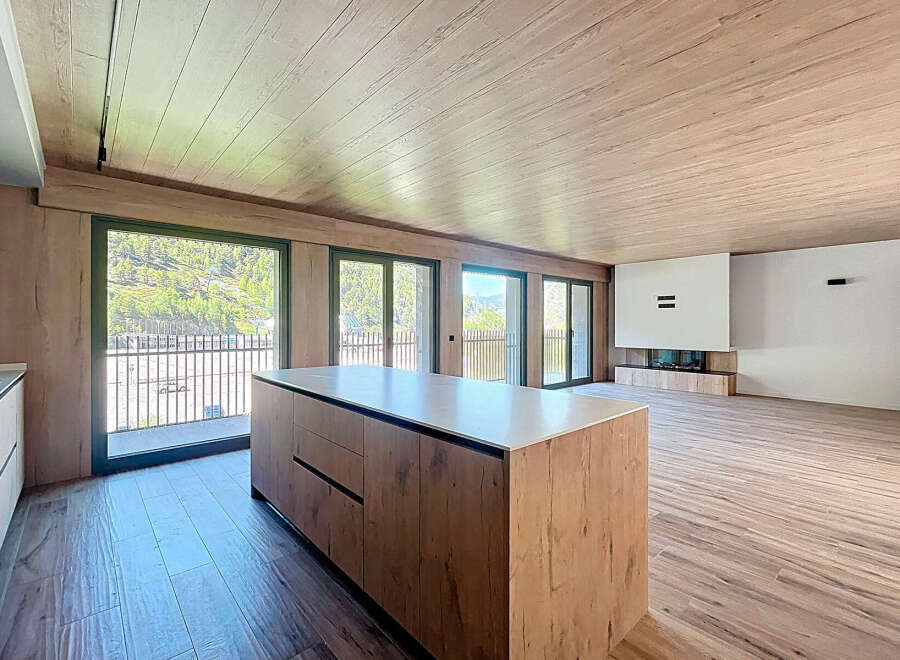 This stunning property boasts an open-plan living area with floor-to-ceiling windows offering breathtaking views.