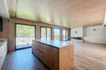 This stunning property boasts an open-plan living area with floor-to-ceiling windows offering breathtaking views.