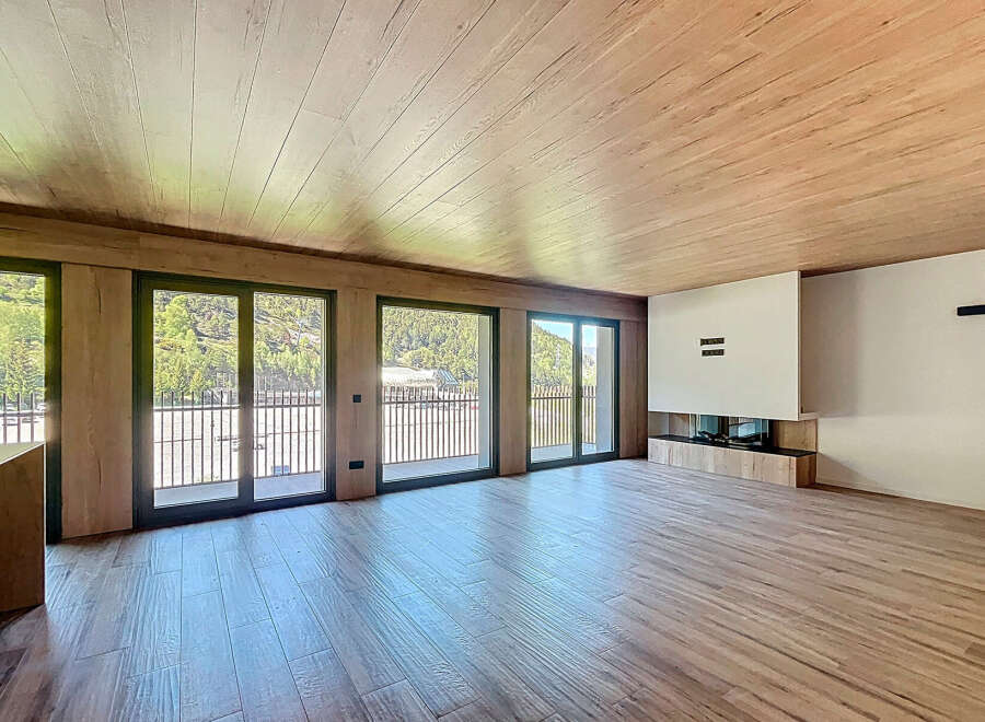 This stunning property boasts a spacious open-plan living area with large windows offering breathtaking views.