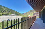 This stunning property boasts a spacious balcony with breathtaking mountain views.