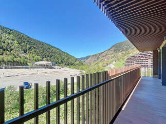 This stunning property boasts a spacious balcony with breathtaking mountain views.