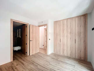 This stunning bedroom boasts a built-in wardrobe with ample storage, perfect for keeping your belongings organized.