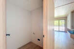 Discover this stunning property featuring a spacious room with light walls and wooden floors.