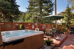 Relax and unwind in your private hot tub, nestled in a charming backyard setting.