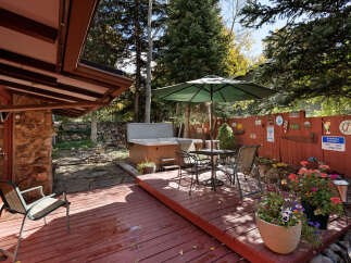 Relax and enjoy the mountain views from your private deck, complete with a hot tub and patio furniture.