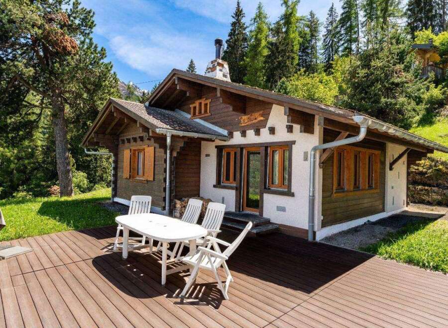 Escape to a charming chalet nestled in a serene, natural setting.