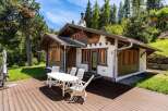 Escape to a charming chalet nestled in a serene, natural setting.