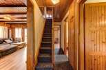 Step into this charming home featuring a cozy interior with wooden accents throughout.