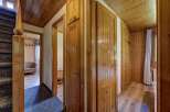 Explore the warm embrace of this inviting home, featuring stunning wooden accents throughout.