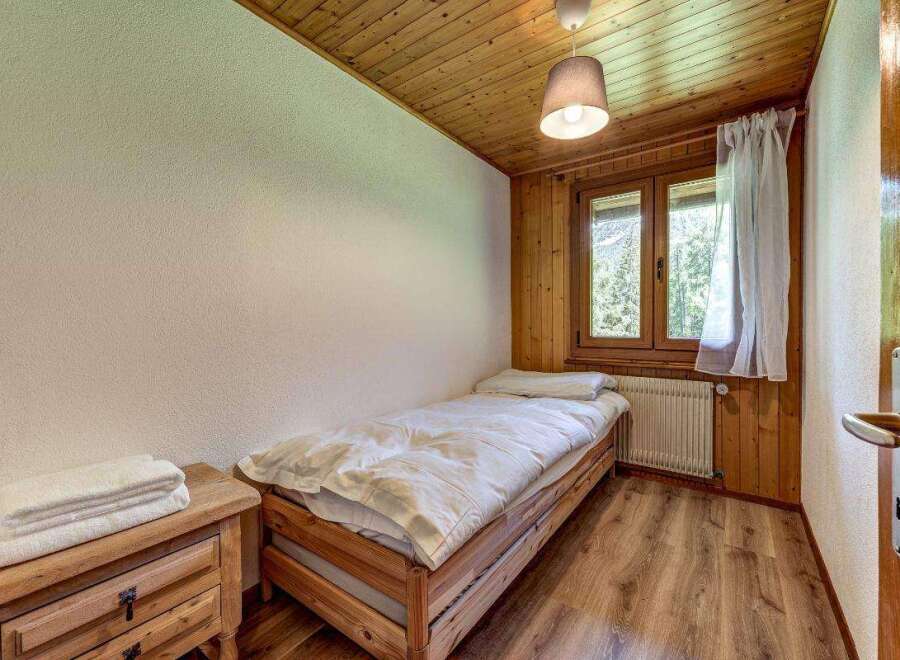 Cozy bedroom with wooden accents.