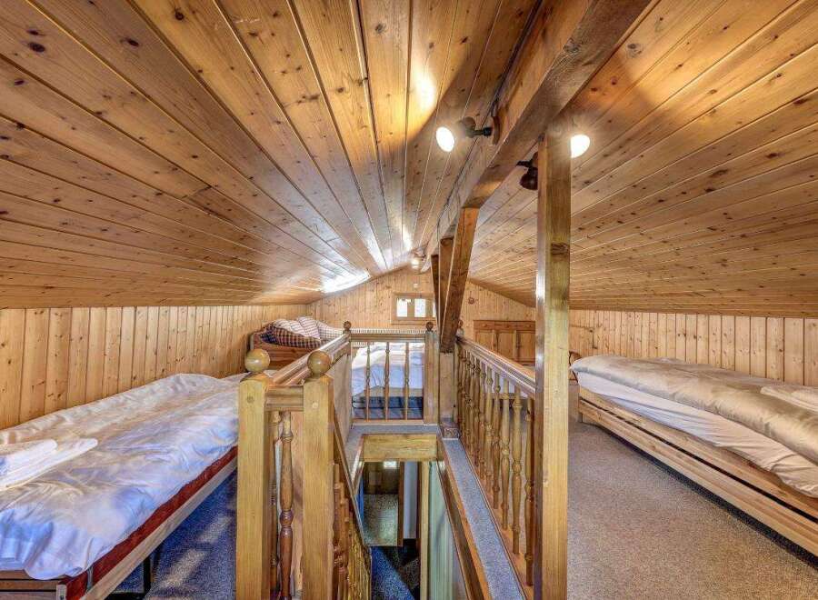 Discover the charm of this cozy cabin with its warm wooden interior and inviting atmosphere.