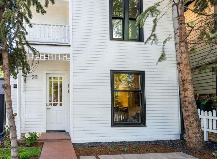 Charming white house with a classic design and modern updates.