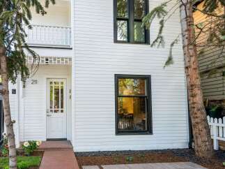 Charming white house with a classic design and modern updates.