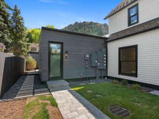 This charming property boasts a private backyard oasis, perfect for relaxation and outdoor enjoyment.