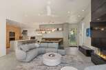 This stunning modern home boasts an open-concept living space seamlessly blending the kitchen, dining, and living areas.