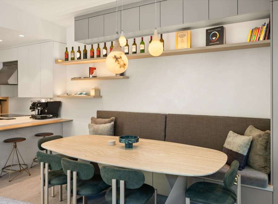 This stunning kitchen boasts a built-in banquette seating area, perfect for intimate dining.